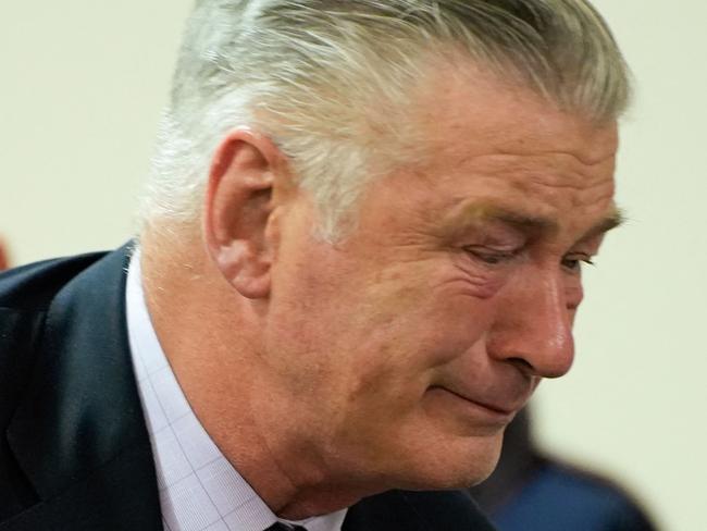 TOPSHOT - US actor Alec Baldwin gets emotional at the conclusion of his trial on involuntary manslaughter at Santa Fe County District Court in Santa Fe, New Mexico, on July 12, 2024. Baldwin's trial for involuntary manslaughter was dismissed by a judge Friday after she ruled that key evidence over a fatal shooting on the set of "Rust" had been withheld from the defense. (Photo by RAMSAY DE GIVE / POOL / AFP)