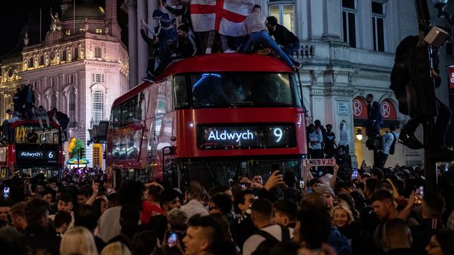 England football fans celebrate in the streets around Piccadilly and Leicester Square after England beat Denmark. Picture: Getty Images.