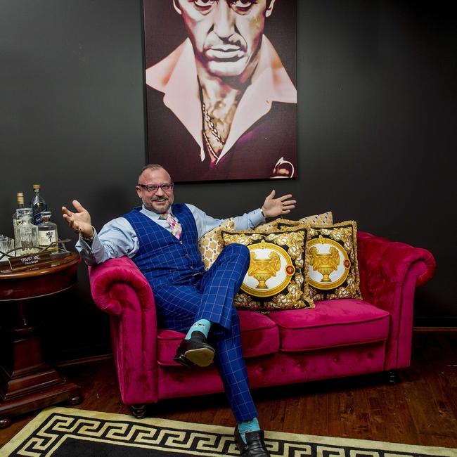 Gold Coast defence lawyer Campbell MacCallum showing off his hot pink couch and Versace carpets and cushions. Picture: Jerad Williams