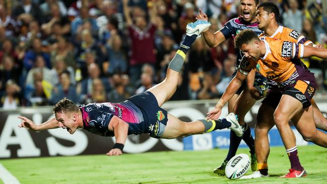 Coen Hess flies over to sink the Broncos. (AAP Image/Michael Chambers)