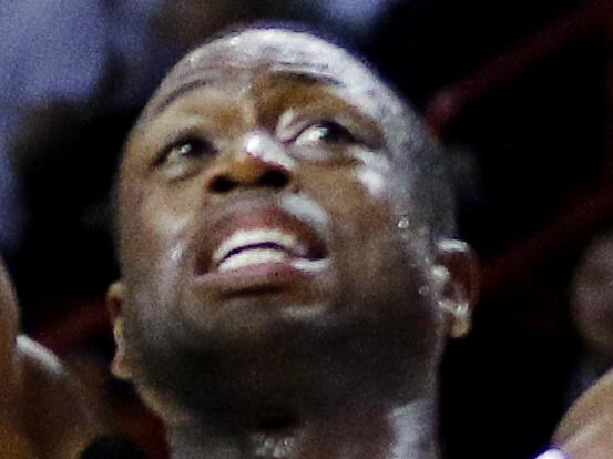 Miami Heat guard Dwyane Wade (3) shoots in the fourth quarter as Oklahoma City Thunder forward Kevin Durant (35) defends in an NBA basketball game, Thursday, Dec. 3, 2015, in Miami. The Heat won the game 97-95. (AP Photo/Joe Skipper)