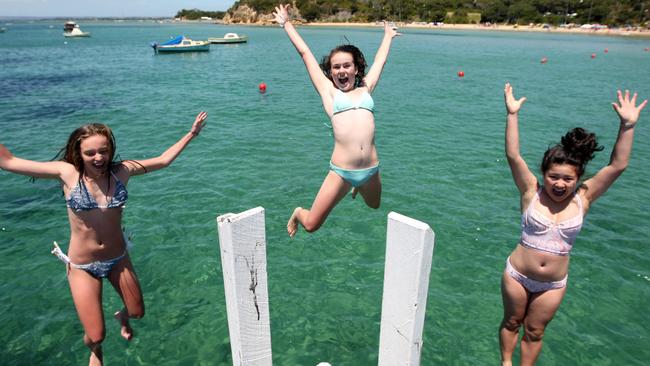 Jumping off Sorrento pier is a popular summer activity for many young people.