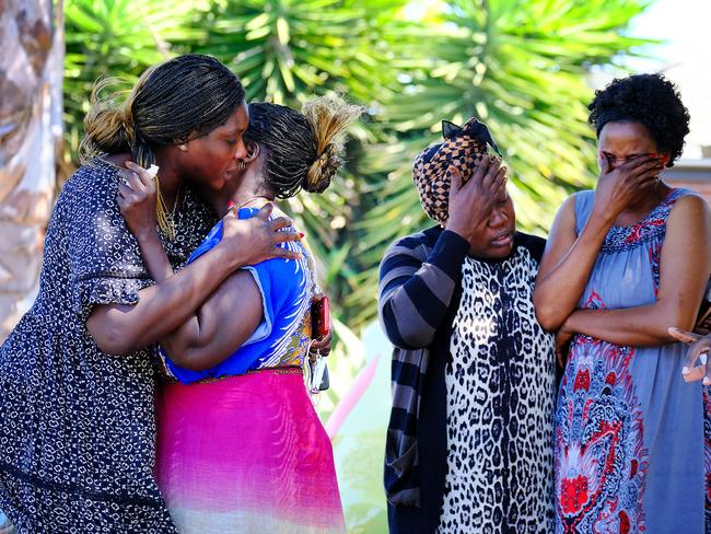 Family and friends of Atem Atem arrive at the scene of the deadly shooting in Wyndham Vale. Picture: NCA NewsWire / Luis Ascui