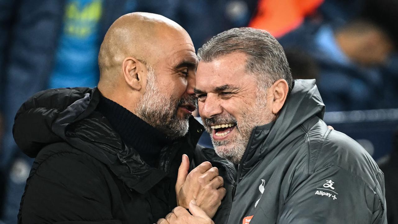 Pep Guardiola and Ange Postecoglou laugh together. Photo by Paul ELLIS / AFP.