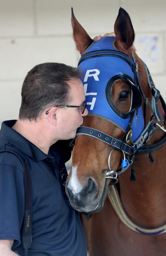 We love you, Buff: Part-owner Chris Lord gives Buffering a kiss. Picture: Darren England