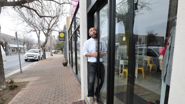 Ali Kadir, state manager for Human Appeal, examines the damage done to his premises. Picture: Tait Schmaal.