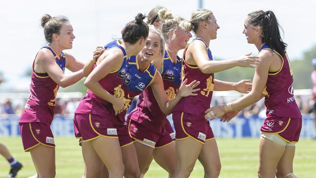 Brisbane players celebrate a win this season. Picture: Mark Cranitch