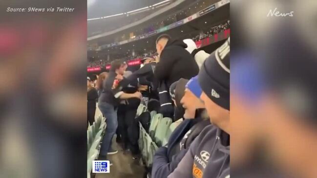 Footy fans involved in violent fight at MCG (9NEWS)