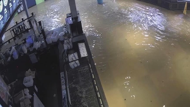 Flooding inside Toombul shopping centre. Photo: Jamie Weston