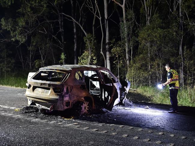 Crash investigators at the scene of a double fatality on the Bruce Highway near Tiaro.