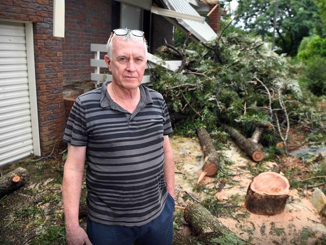 The clean up starts for Beerwah resident Noel Barrie following Thursday morning’s severe thunderstorms. Photo: Patrick Woods.