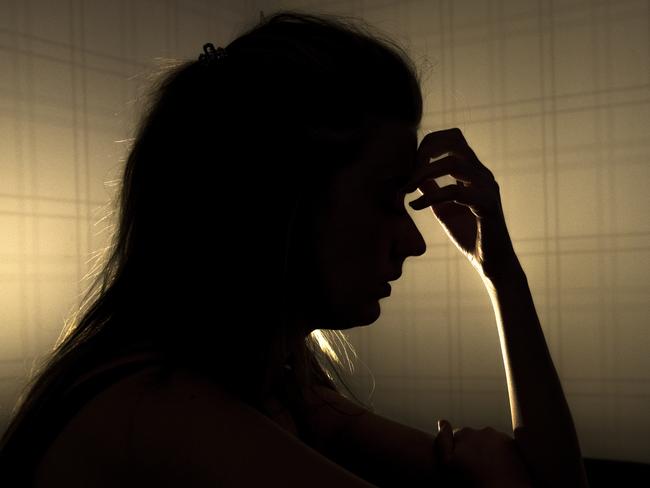 sad woman profile in dark head is put down, stressed young girl touching head and thinkingsad woman profile in dark head is put down, stressed young girl touching head and thinking