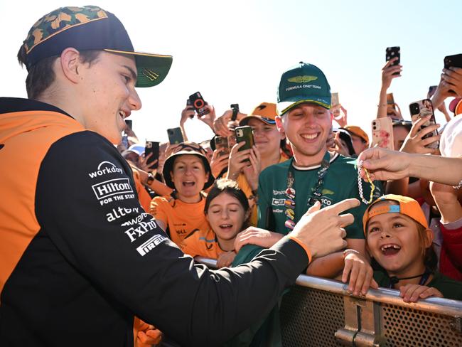 Australian McLaren driver Oscar Piastri signs autographs ahead of the 2024 F1 Grand Prix. Picture: Getty Images