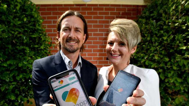 CareApp founder Allison Nikula and Southern Angels member Nick Heywood-Smith check out the app at St Louis Residential Care facility, Parkside. Picture: Sam Wundke/AAP