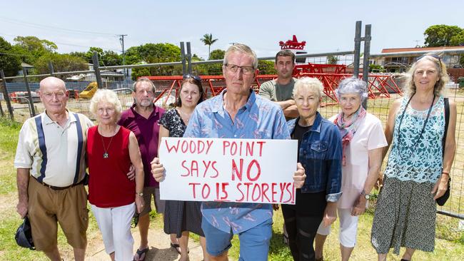 Derek Catterall with neighbours of the development site bounded by Kate Street, Lilla Street, and Gayundah Esplanade in Woody Point. Photo: AAP /Richard Walker