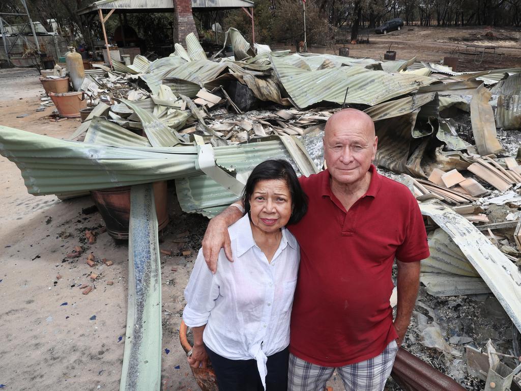 Tony and Digna Antonucci with the burned out remains of their house near Moyston. Picture: David Crosling