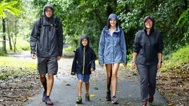 The last few days have seen more than 100mm of rain in Cairns. French tourists Laurent Paquier, Mael Paquier, 9, Mathilde, 11, and Pauline Paquier enjoy a walk through the rainforest at Crystal Cascades on their holiday to Cairns. Picture: Brendan Radke