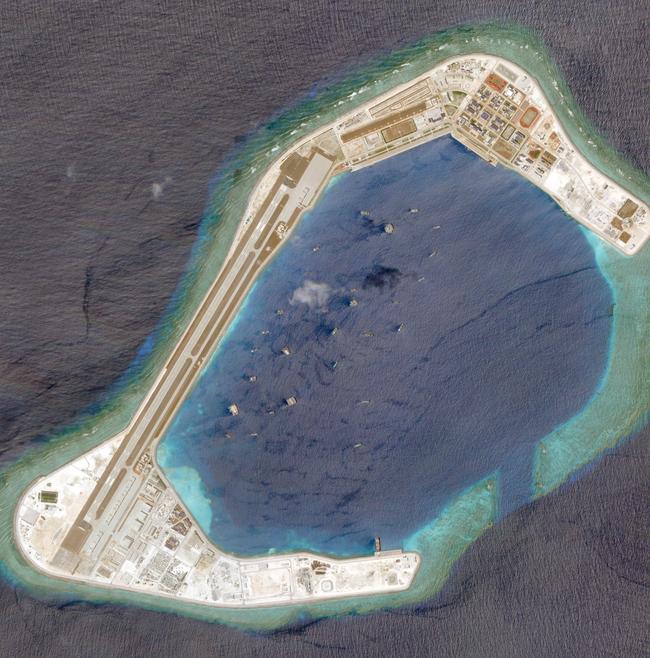 A atellite photo dated March 20, 2018, showing the artificial island fortress of Subi Reef - just 24km from the Philippine-occupied Thitu Island. Picture: Planet Labs Inc/Handout