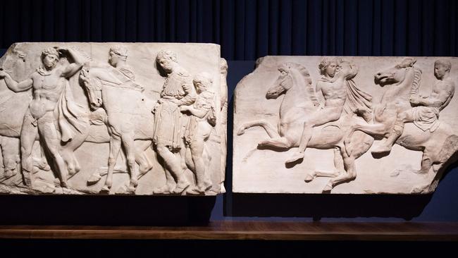 (FILES) In this file photo taken on March 24, 2015 two sections of marble frieze sculptures (438-432 BC) from the Parthenon in Athens, part of the collection that is popularly referred to as the Elgin Marbles, are displayed during a press preview of the British Museum's "Defining beauty: the body in ancient Greek art" in central London. - The Parthenon Marbles could soon be returned to Greece from the British Museum as part of a "cultural exchange" being negotiated with Athens, a report said on January 4, 2023. The ancient sculptures, also known as the Elgin Marbles, were taken from the Parthenon temple at the Acropolis in Athens in the early 19th century by British diplomat Thomas Bruce, the earl of Elgin. (Photo by LEON NEAL / AFP)