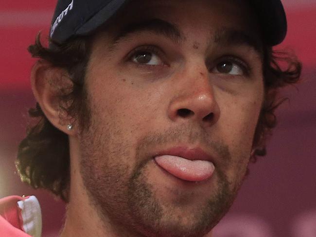 Australian Michael Matthews celebrates with the pink jersey of the overall leader on the podium of the 4th stage of the 97th Giro d'Italia (Tour of Italy) cycling race, on May 13, 2014 in Bari. AFP PHOTO/LUK BENIES