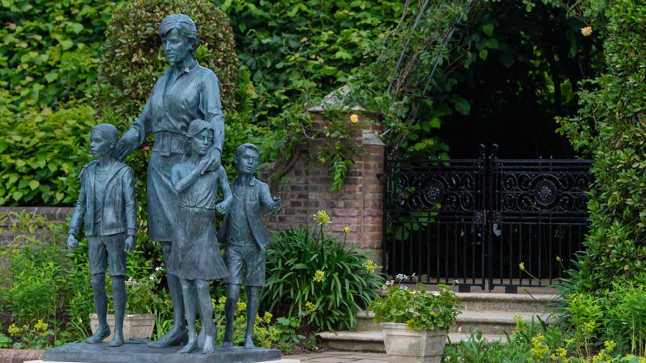 The bronze statue depicts the princess surrounded by three children to represent the "universality and generational impact" of her work. Picture: Dominic Lipinski – WPA Pool/Getty Images.