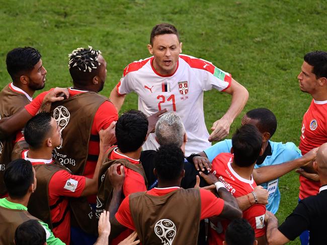 Nemanja Matic taking on the whole Costa Rica bench. Picture: AFP