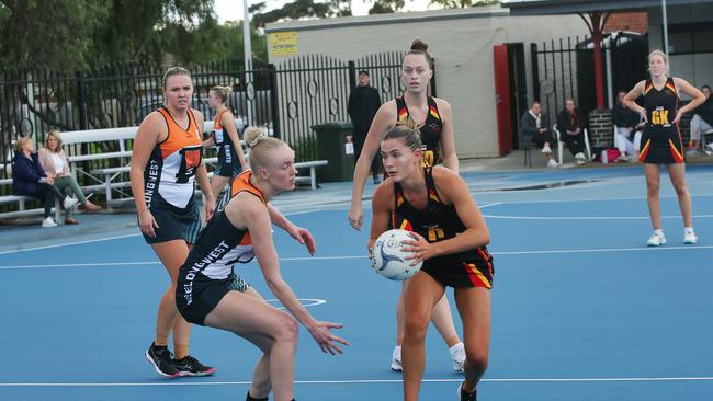 St Joseph's Elli Leydin (C) tries to find a way passed Giants Nikita Handley (C). Geelong West Giants v St Joseph's A Grade netball at West Oval. Picture: Alan Barber