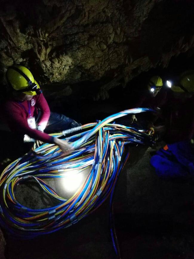 A rescue personnel preparing cables inside Tham Luang cave. Picture: AFP