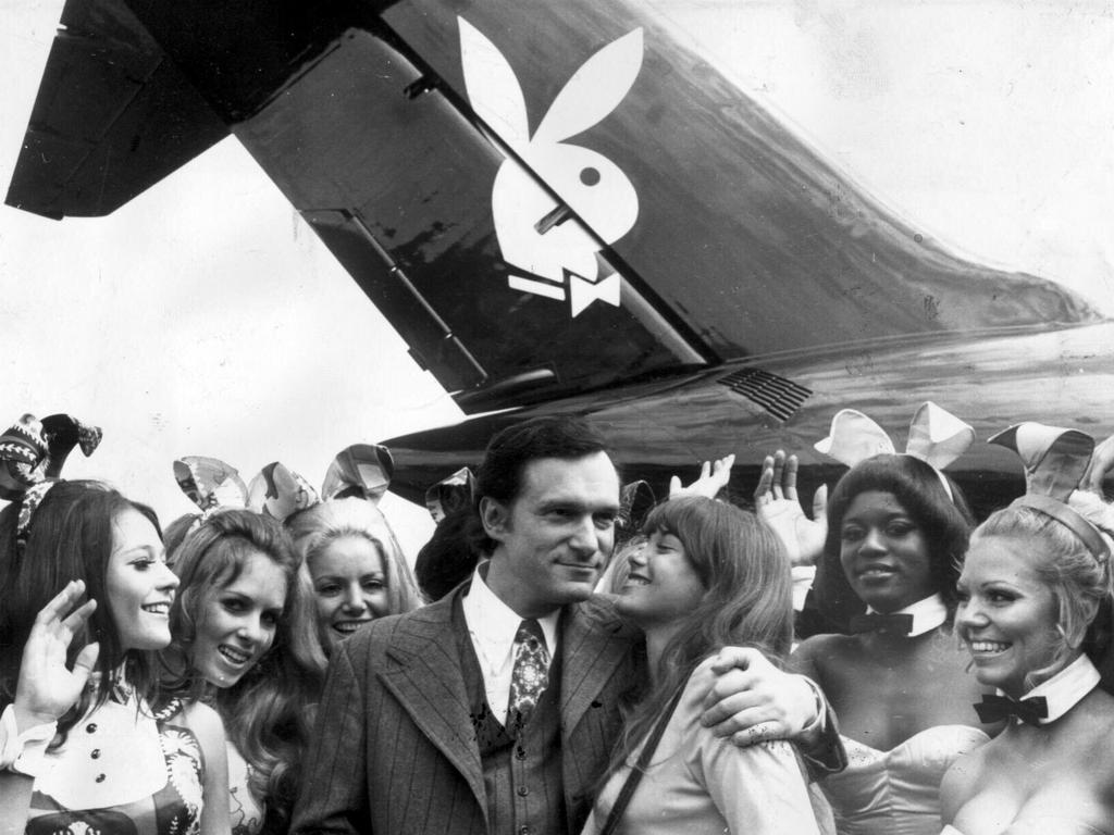 <p>Playboy Enterprises founder and president Hugh Hefner gets a kiss from his girlfriend Barbara Benton under the tail of his 'Big Bunny' aircraft, 20/07/1970. Pic Keystone.</p>