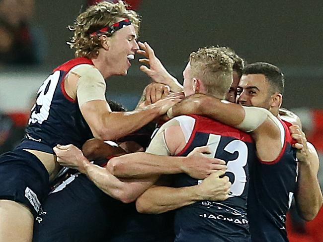 GOLD COAST, AUSTRALIA - MAY 11: Melbourne celebrate the win during the round eight AFL match between the Gold Coast Suns and the Melbourne Demons at Metricon Stadium on May 11, 2019 in Gold Coast, Australia. (Photo by Jono Searle/AFL Photos/Getty Images)