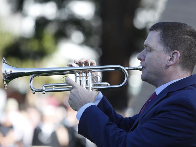 The bugler plays the Last Post. Picture: Robert Pozo