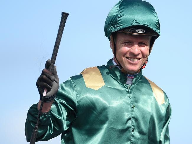 McEvoy gestures after riding King’s Legacy to victory at Eagle Farm.