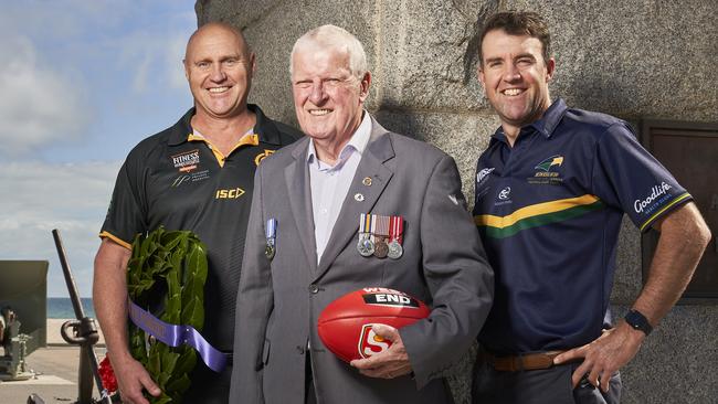 Glenelg coach Brett Hand (left) with Semaphore Port Adelaide RSL Club president Derek Meadows and Eagles coach Jade Sheedy at the Semaphore War Memorial. Picture: Matt Loxton