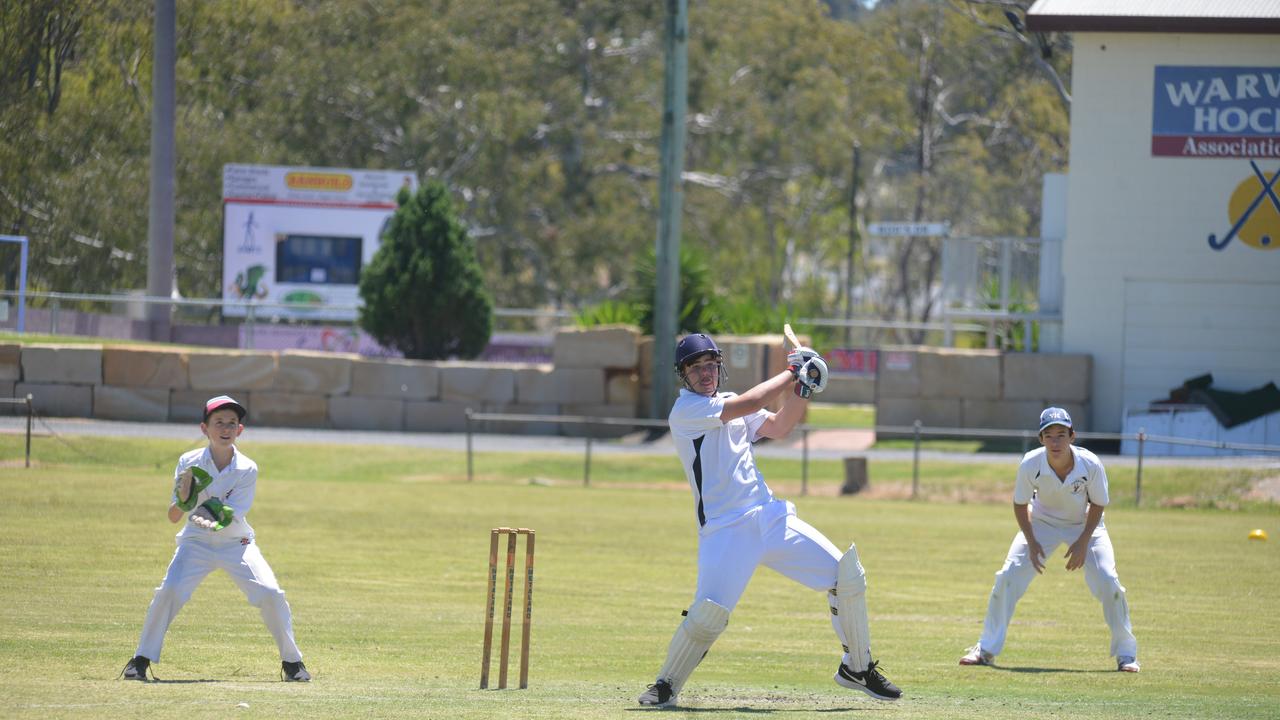 Pat Gordon keeps wickets as Cooper Tate-Roche goes for his shots in Warwick junior cricket. Picture: file