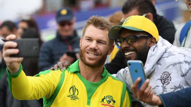 TAUNTON, ENGLAND - JUNE 12: David Warner of Australia poses for photos with fans during the Group Stage match of the ICC Cricket World Cup 2019 between Australia and Pakistan at The County Ground on June 12, 2019 in Taunton, England. (Photo by Alex Davidson/Getty Images)