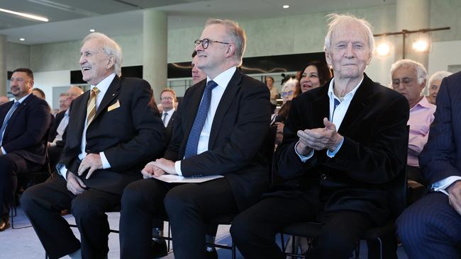 John Brown AO, Prime Minister Anthony Albanese and Paul Hogan AM at thew launch of Brownie: Minister for Good Times book launch at the Winx Stand at Royal Randwick in Sydney. Picture: Richard Dobson