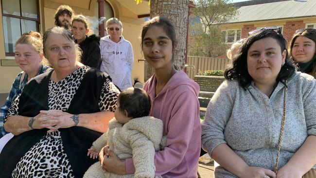 Family and friends of Brandon Clark including his mother Kate Layland (front left) and brother Ben Clark (behind her) and Ben's wife Ayesha with their baby outside Taree Local Court on the first day of the inquest into Brandon Clark's death. Picture: Janine Watson