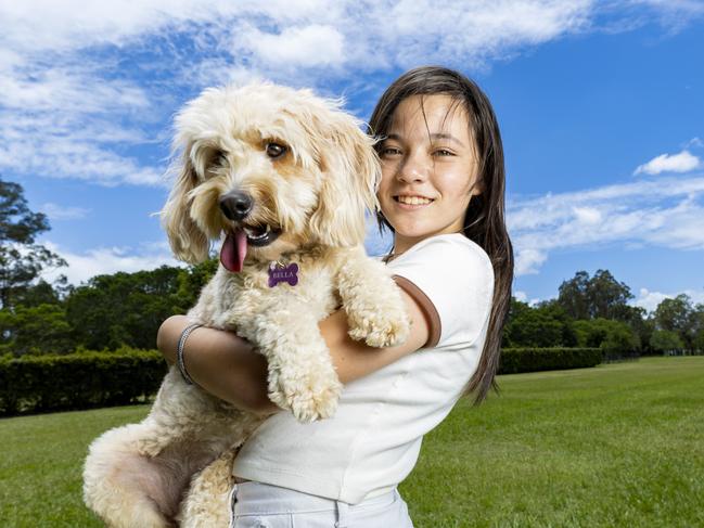 Isis Matthews with her Cavoodle, Bella. Bella was one of the most popular dog names of 2022 in Brisbane. Picture: Richard Walker