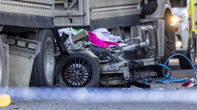 The car wedged under a truck at the scene of a crash which claimed the life of a young man on Wednesday. Picture: David Geraghty