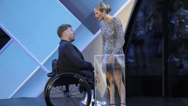 2022 Australian of the Year Dylan Alcott greets 2021 Australian of the Year Grace Tame at the 2022 Awards on Tyesday night. PictureBrook Mitchell/Getty Images