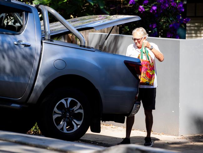 The man helps pack a car with boxes and bags from inside 54 Edward St on Friday. Picture: Tom Parrish