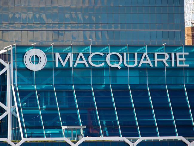 The Macquarie Group Ltd. logo is displayed on the facade of the Macquarie Group Building in Sydney, Australia, on Friday, April 27, 2012. Macquarie Group Ltd., Australia's largest investment bank, said it's relying on cost cuts to revive earnings after a slump in trading income and dealmaking dragged full-year net income to an eight-year low. Photographer: Ian Waldie/Bloomberg