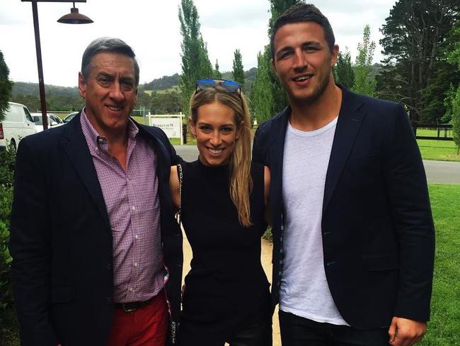 Phoebe flanked by her dad Mitchell Hooke (left) and Sam. Burgess has been charged with intimating Mr Hooke after an incident at his Bowral home last month.