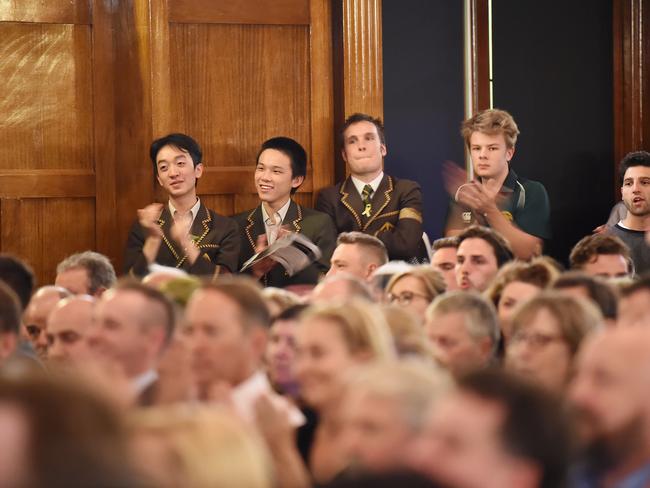 Trinity College students watch on during the packed meeting. Picture: Lawrence Pinder