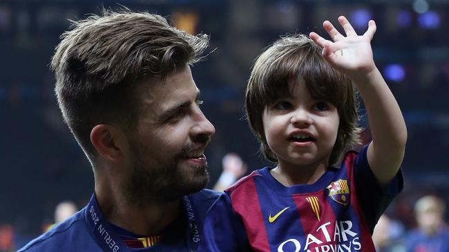 Gerard Pique and his son Milan celebrate Barcelona’s  victory after the UEFA Champions League Final. Picture: Getty