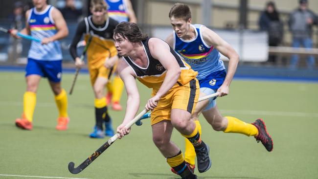 Christian Ramsay (front) of Sunshine Coast under pressure from Hayden Dorge of Toowoomba 1 in Hockey Queensland Championships at Clyde Park, Sunday, May 2, 2021. Picture: Kevin Farmer