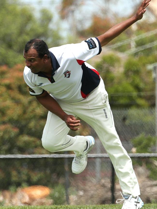 Playing coach Rasika Batepola charges in for Diggers Rest Bulla. Picture: Hamish Blair