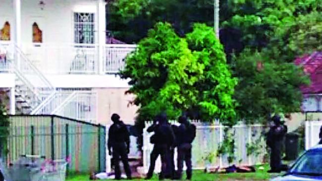 Police storm the Fairfield house. Pic: supplied