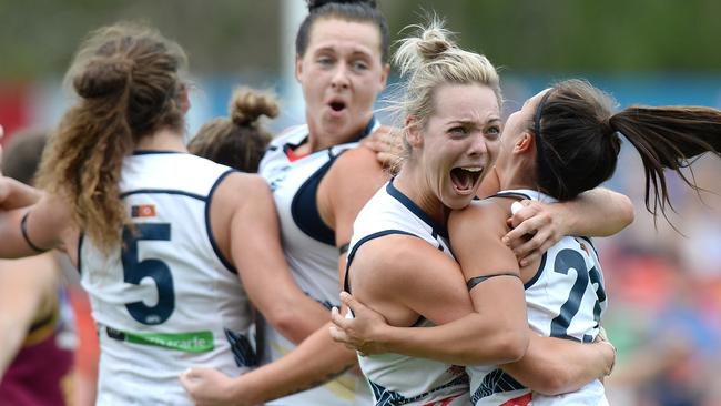 Adelaide players celebrate winning the 2017 AFLW premiership. Picture: Bradley Kanaris