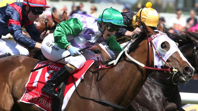 Prince of Penzance (centre), ridden by Michelle Payne, comes home to win The Melbourne Cup with 100m to go during Melbourne Cup Day at Flemington Racecourse in Melbourne, Tuesday, Nov. 3, 2015. (AAP Image/David Crosling) NO ARCHIVING, EDITORIAL USE ONLY
